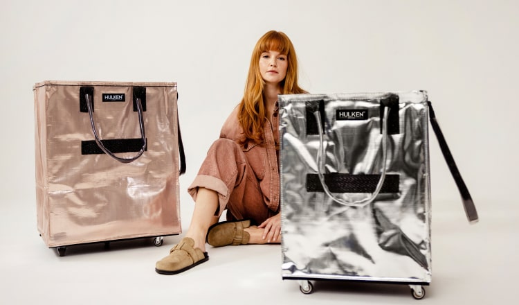 Woman posing with two tote bags