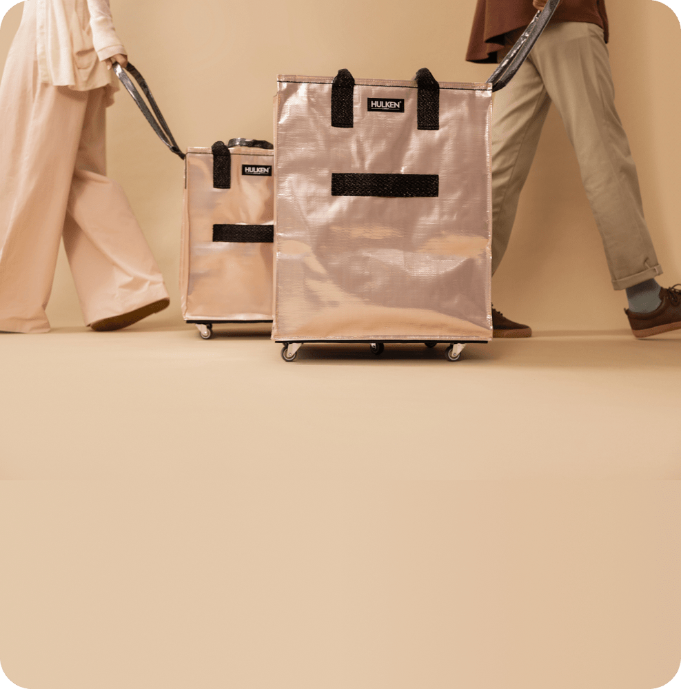 People carrying rose gold tote bags