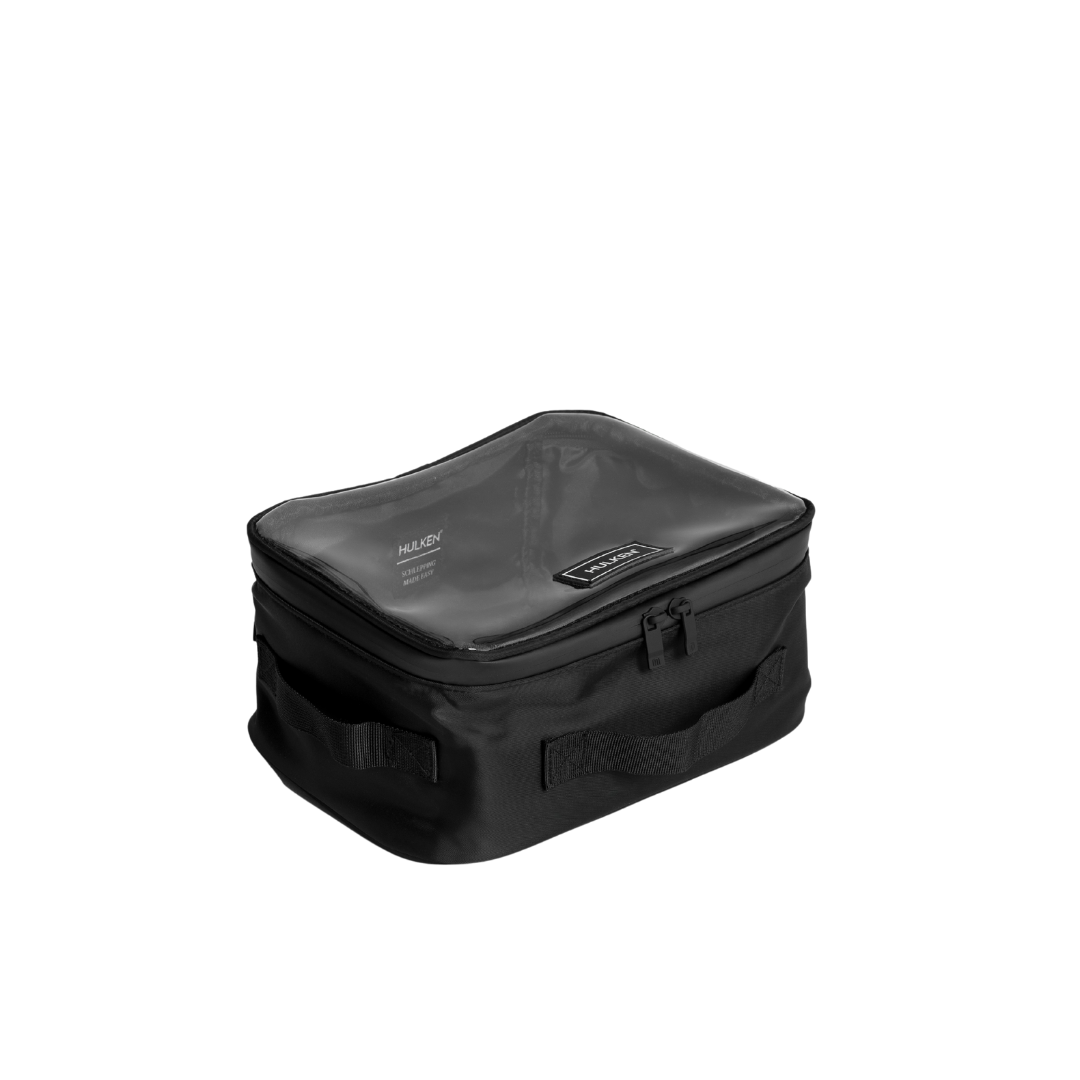 Black travel bag with visible brand logo on a white background