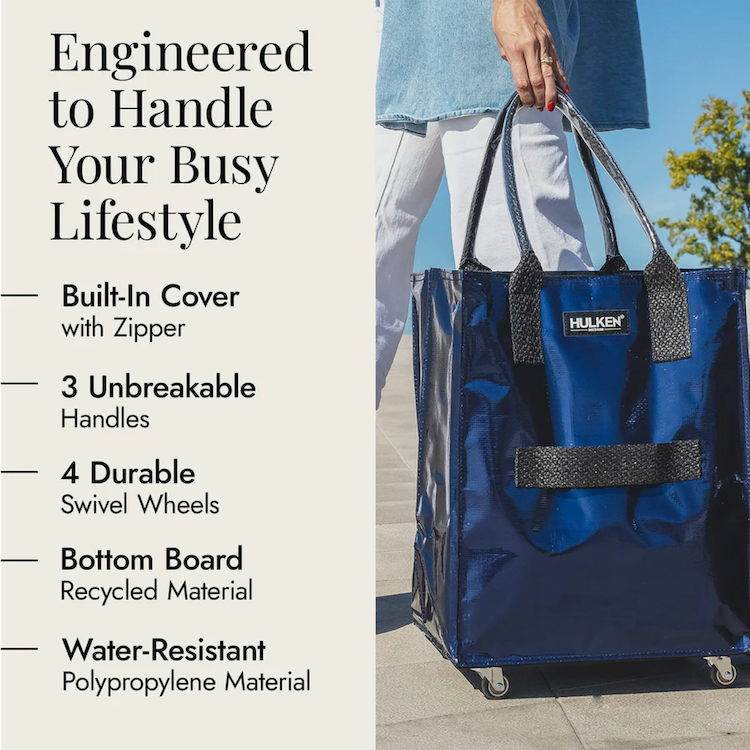 Person walking with a stylish midnight blue tote bag