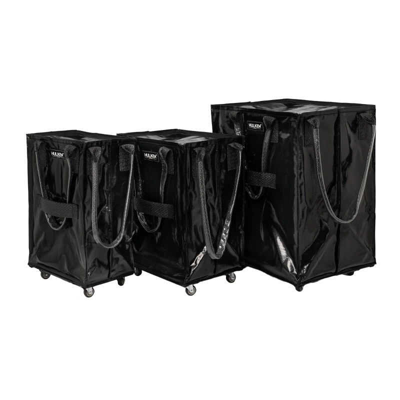 Three sizes of black tote bags side by side for comparison