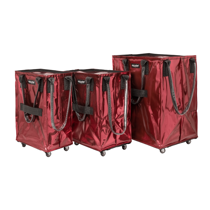 Three sizes of silver tote bags side by side for comparison.