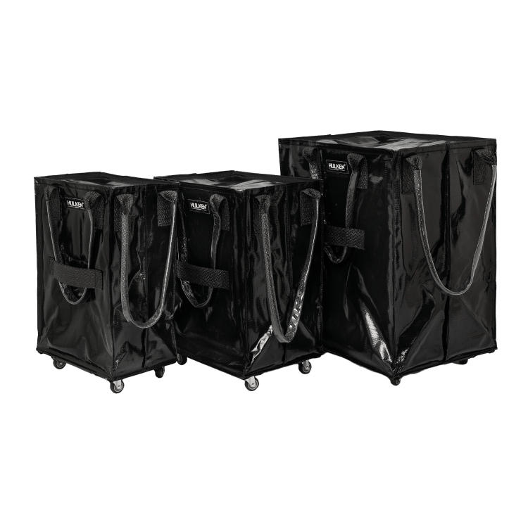 Three sizes of black tote bags side by side for comparison.